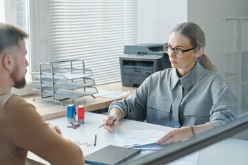 woman and man in green card interview