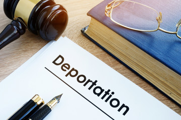 paper that says deported and gavel united states