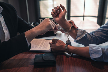 person taking handcuffs off other person