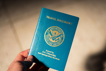 person's hand holding reentry permit; Montgomery County U/T Visa Lawyer concept image
