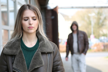 man stalking a woman