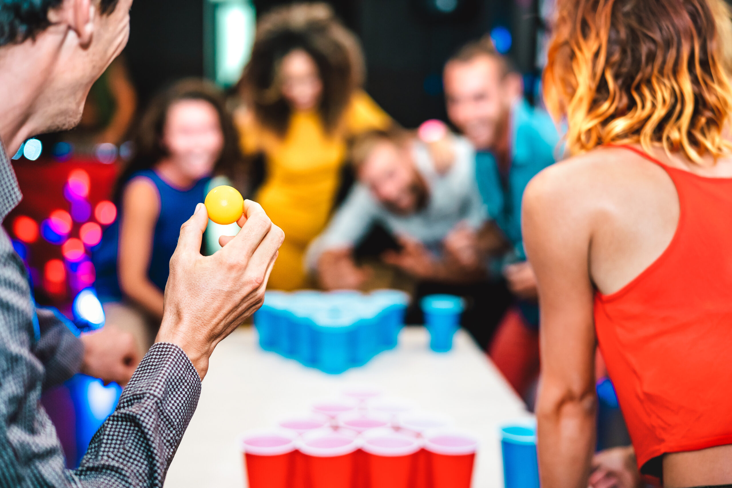 College freshman party with underage drinking and several students playing beer pong; Montgomery County Underage Drinking Lawyer concept image