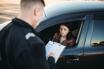 police officer and woman during traffic stop